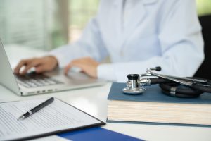 Medical Education Learning concept. stethoscope on medical textbook with doctor are learning continuing medical education. Medical Education Learning concept. stethoscope on medical textbook with doctor are learning continuing medical education.